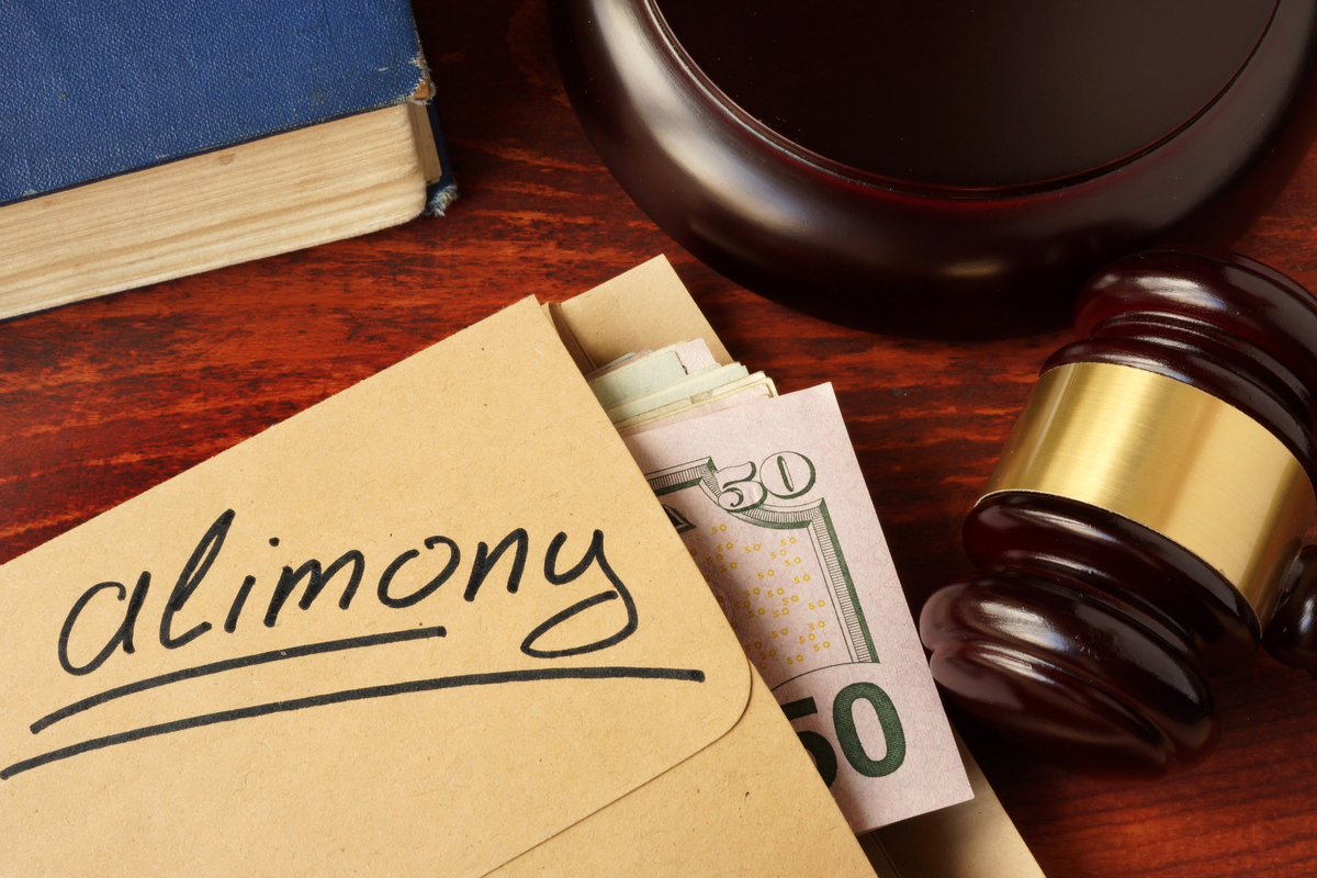 Alimony payment in an envelope on a courthouse desk