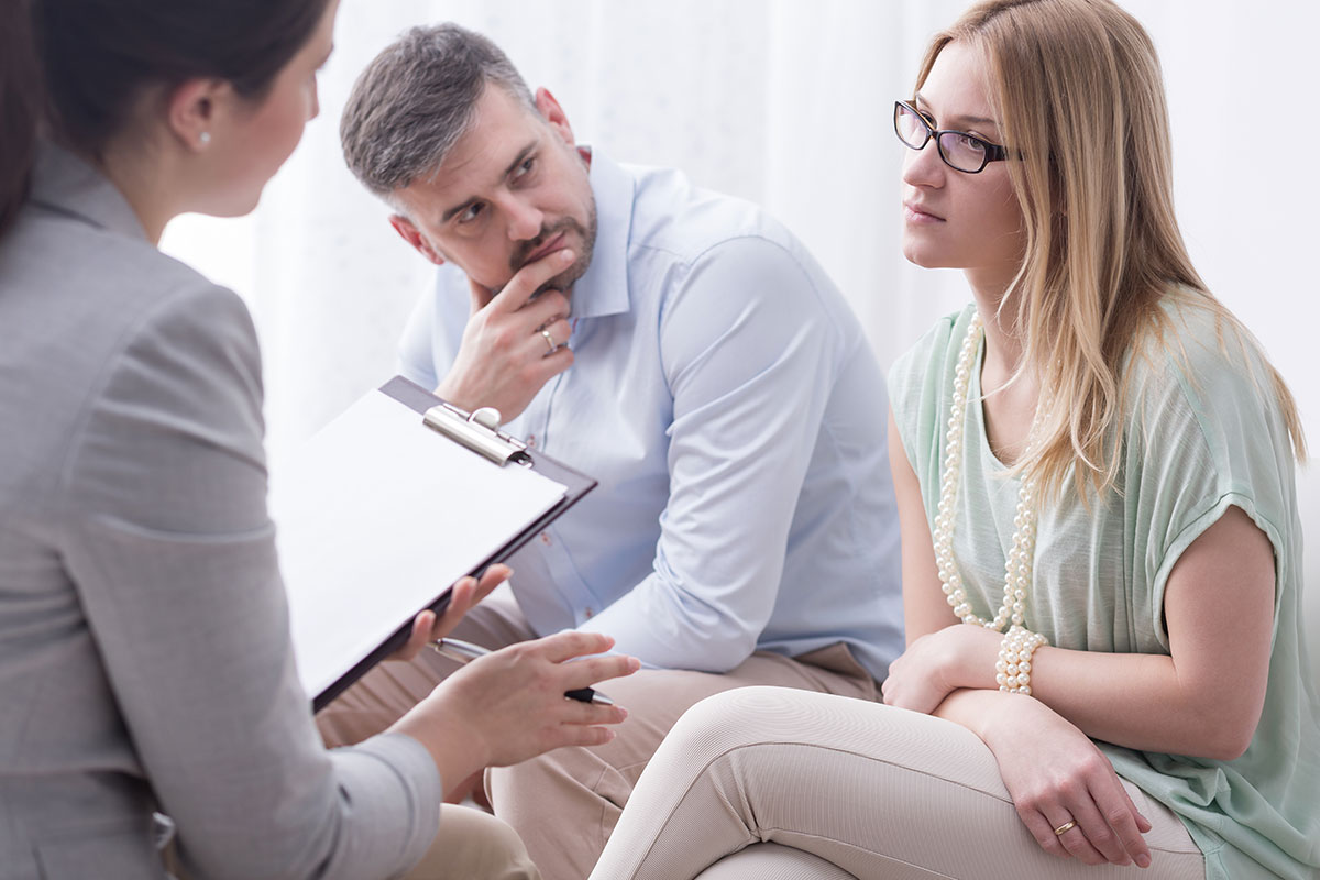 Divorced couple going through a mediation with an attorney in Phoenix