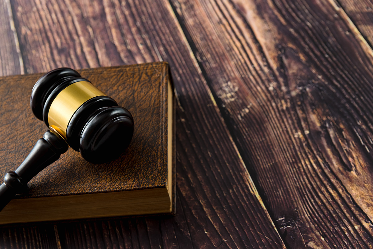 a gavel sits atop a table in a courtroom