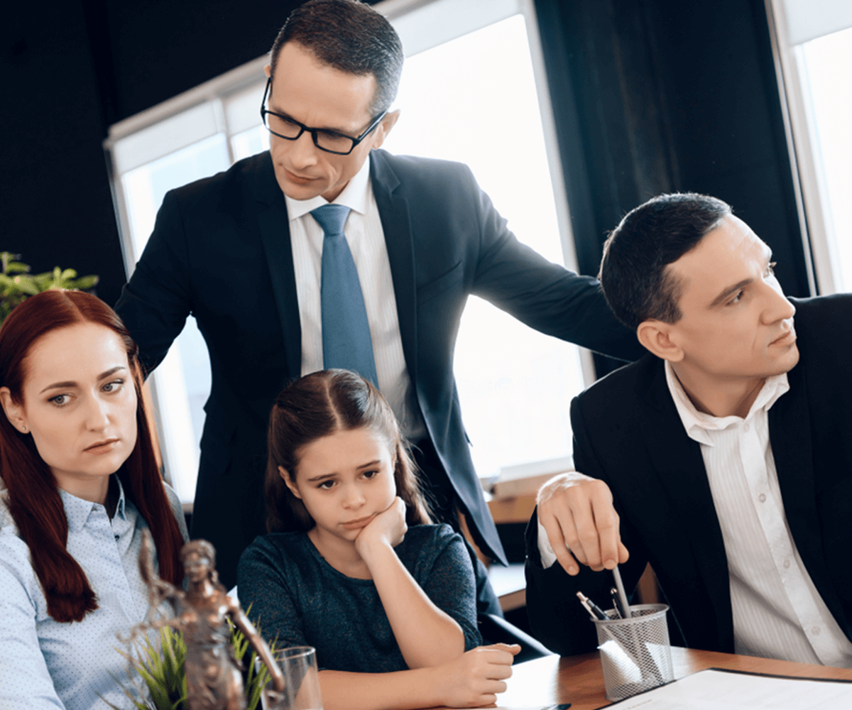 divorce lawyer stands next to parents and child